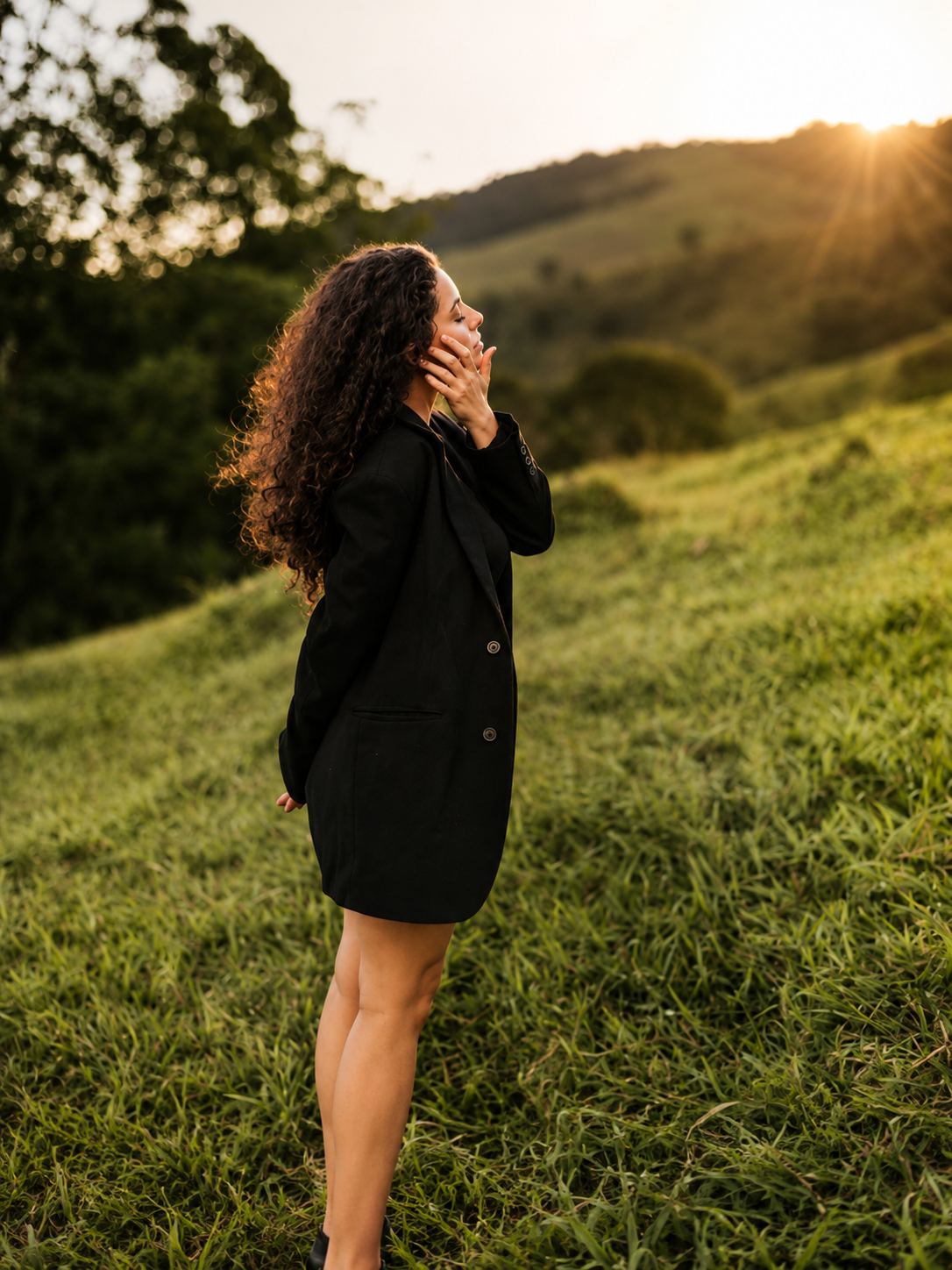 A woman reflecting in a peaceful landscape